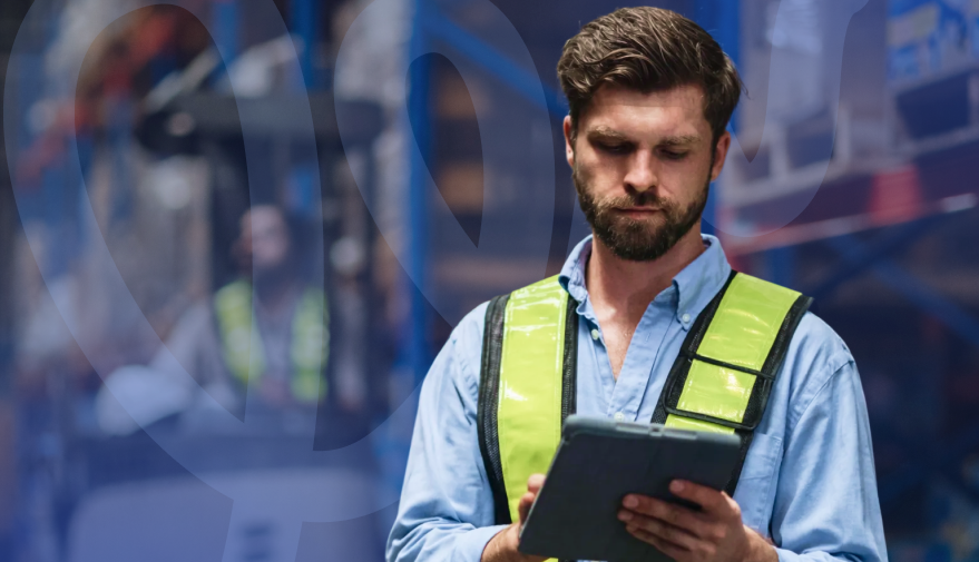 male engineer holding tablet using the Geeni Sign feature of Service Geeni
