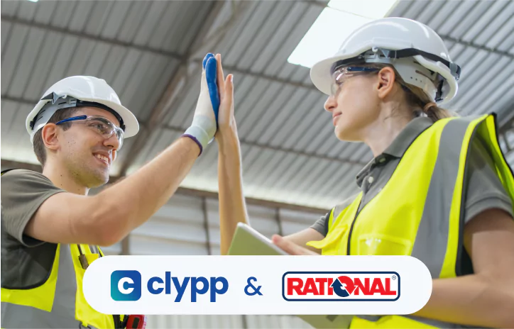Two industrial workers giving a high five with Clypp and Rational partnership logos – successful collaboration in training
