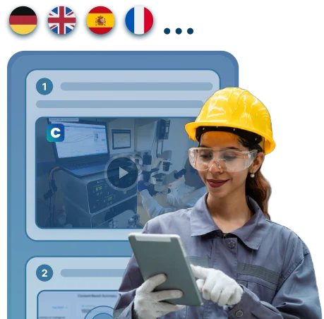 Factory worker with safety gear using a tablet, in front of multilingual training video previews.
