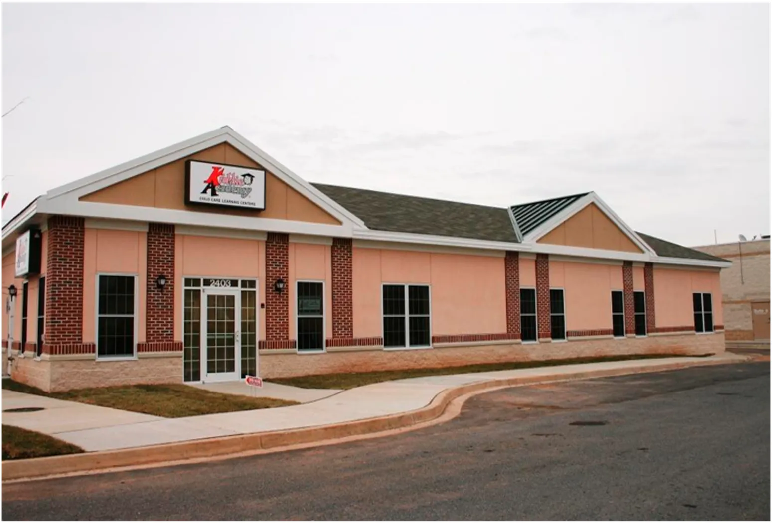 Kiddie Academy, a child care learning center, is located at 2403 in a modern building.
