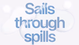 Text 'Sails through spills' in a soft blue font with abstract light blue bubble shapes in the background.