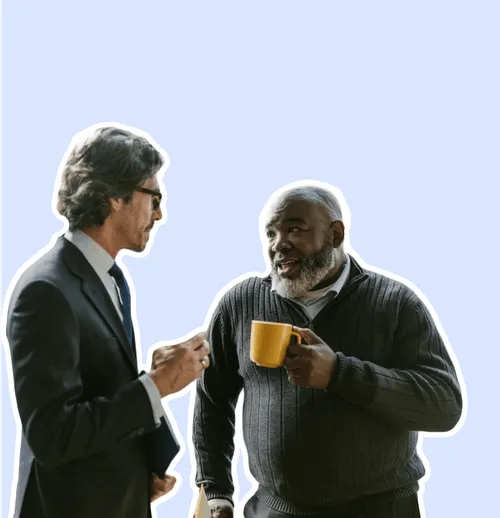 Two tax professionals having a conversation over coffee.