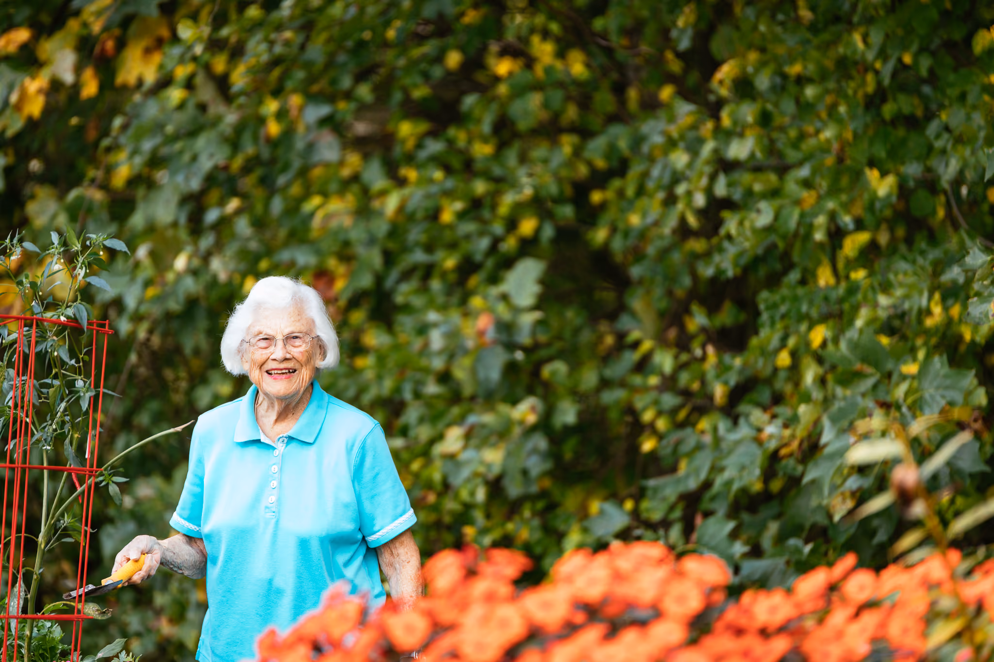 Pat Jollie tending to her garden. There are 28 raised garden beds at Ardenwoods.