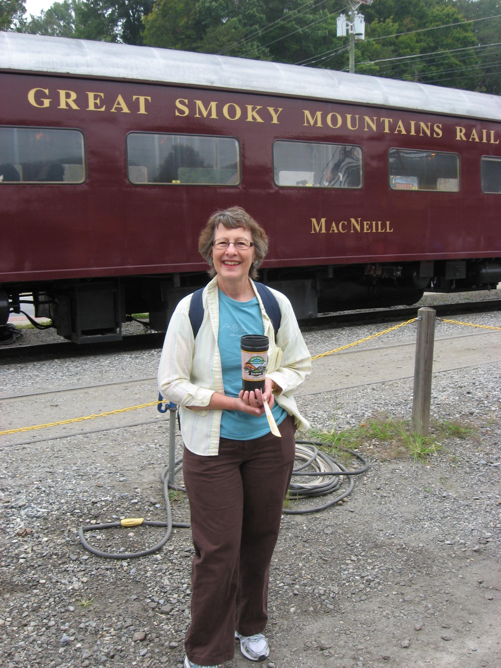Bobbi in front of a Great Smoky Mountains Railroad train car
