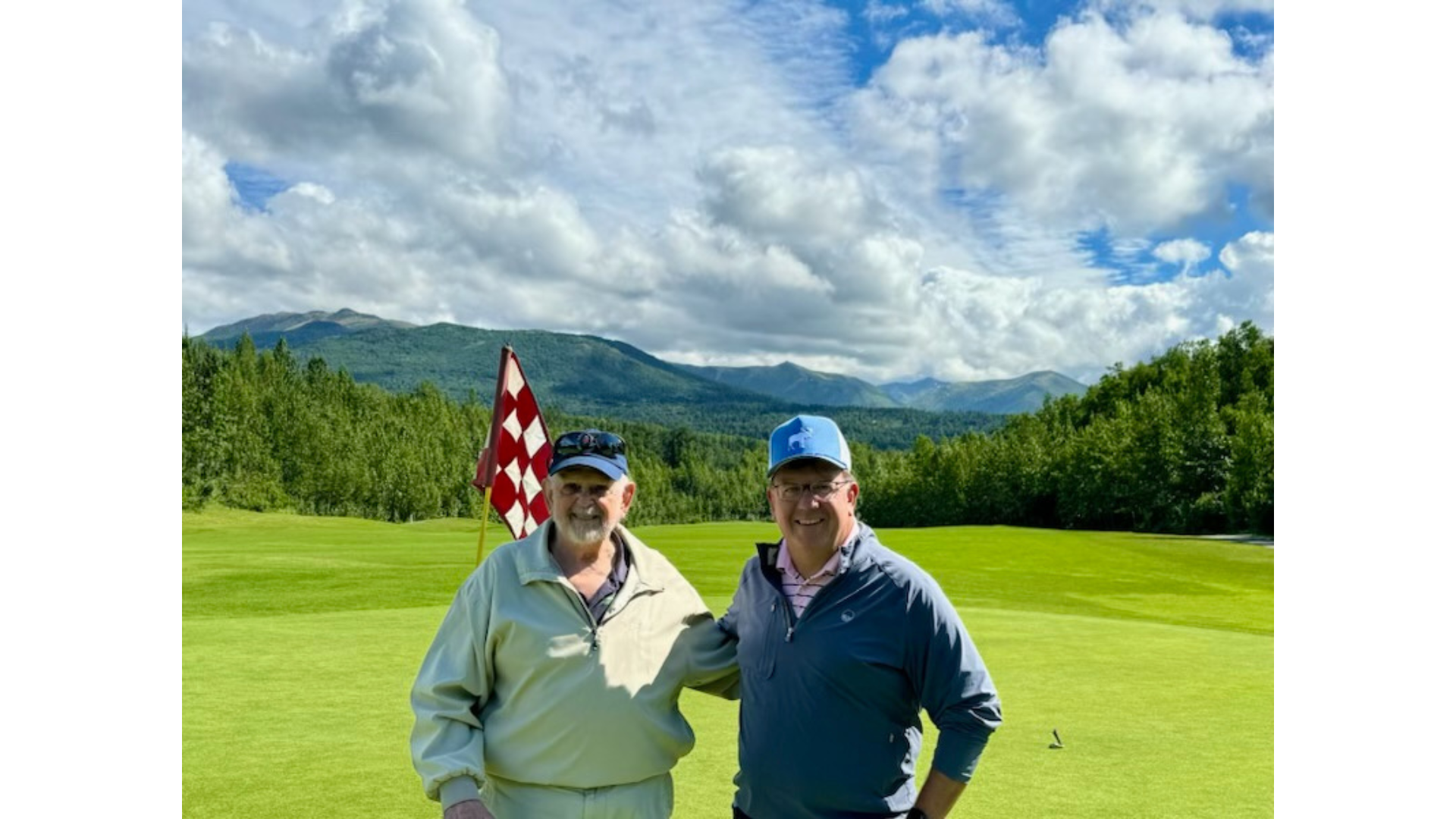 Dave Griffith (left) and his son Brad Griffith (right) standing next to each other on a golf course.