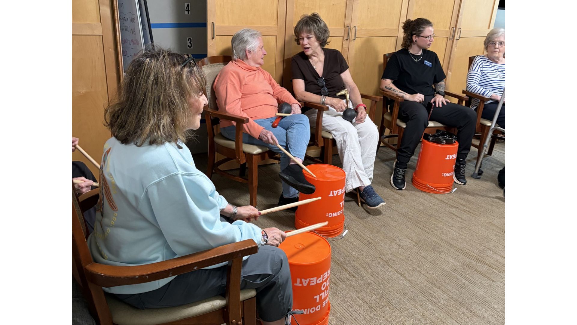 Heather Glen residents participate in Sounds of Summer, led by Taylor Sigmon a certified music therapist.