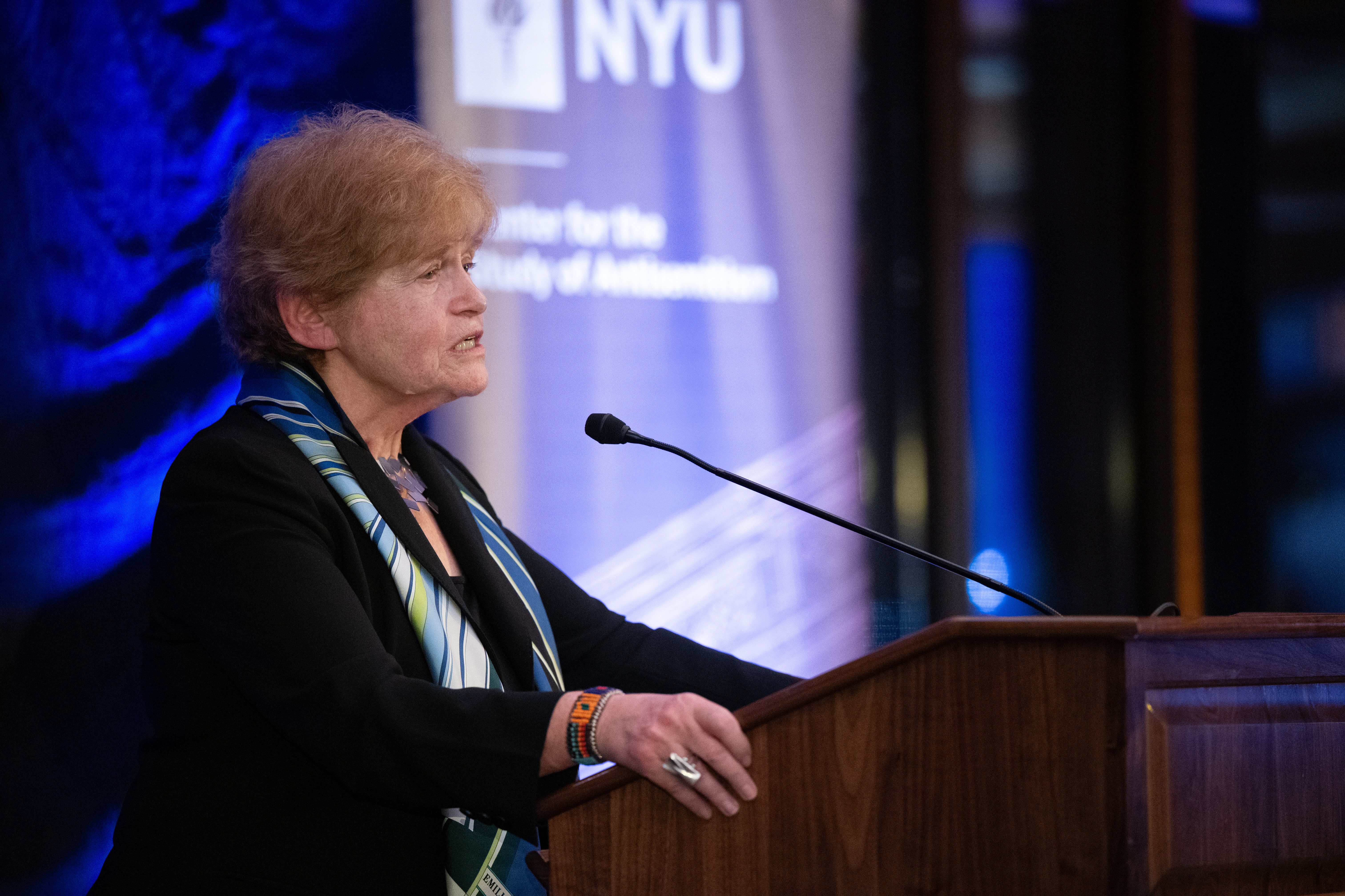 Purple background with Lila Berman on the left and Avinoam Patt on the right smiling at camera. Title of podcast at the top and hosts names on the right.