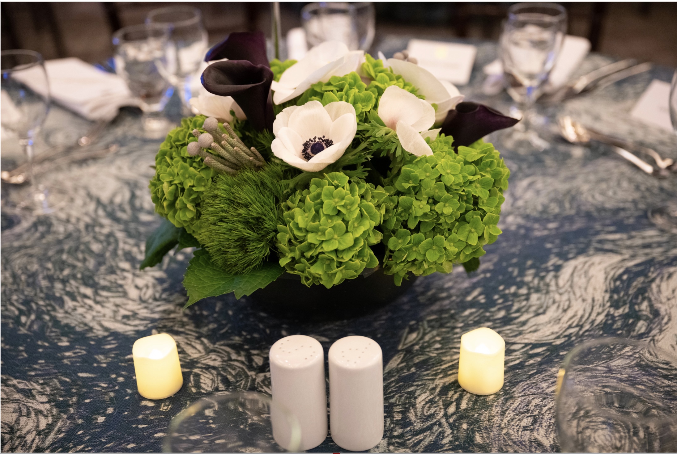 Avinoam Patt speaking at wooden podium in front of room