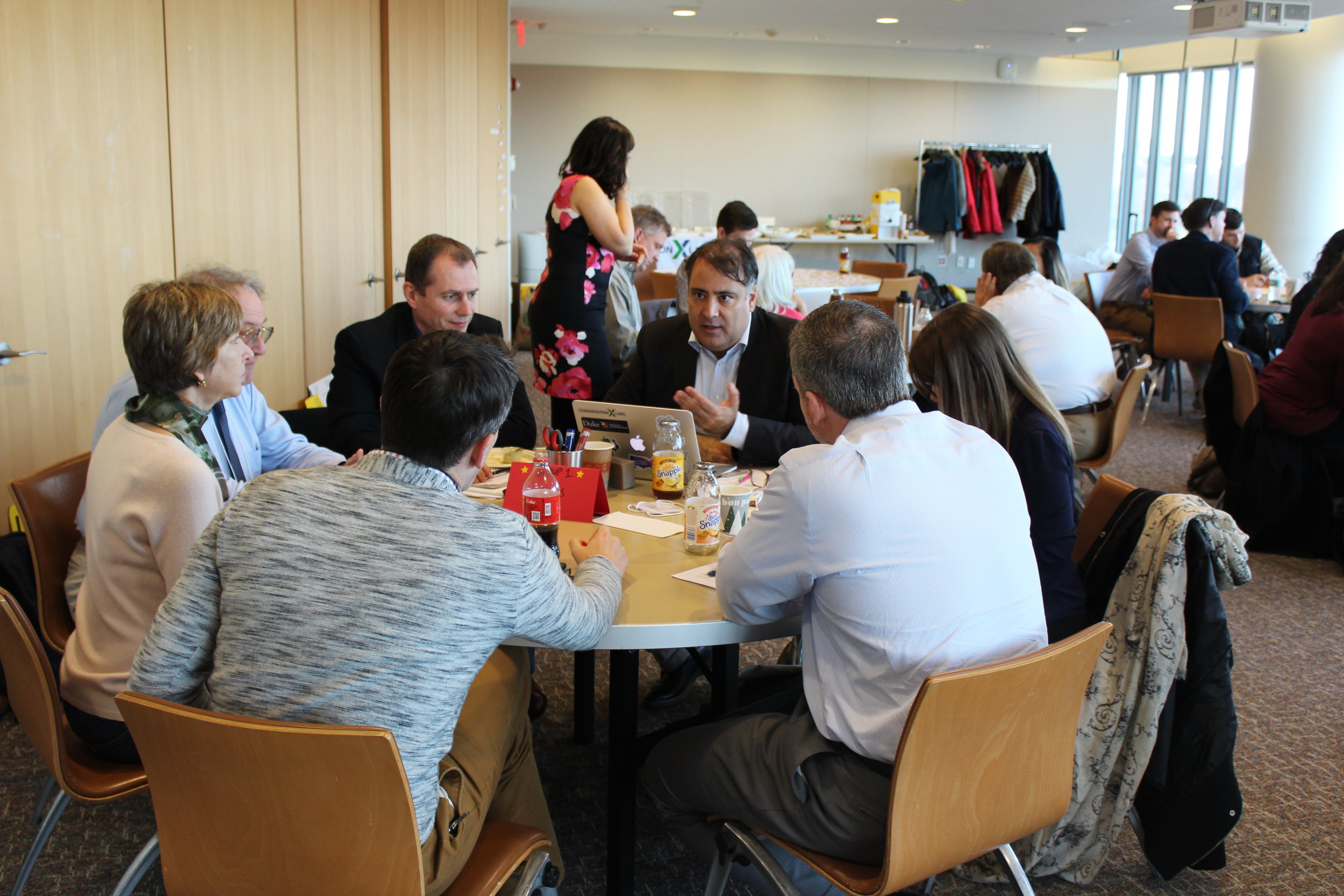 Alex Dehgan, CEO of Conservation X Labs, facilitates a group discussion.