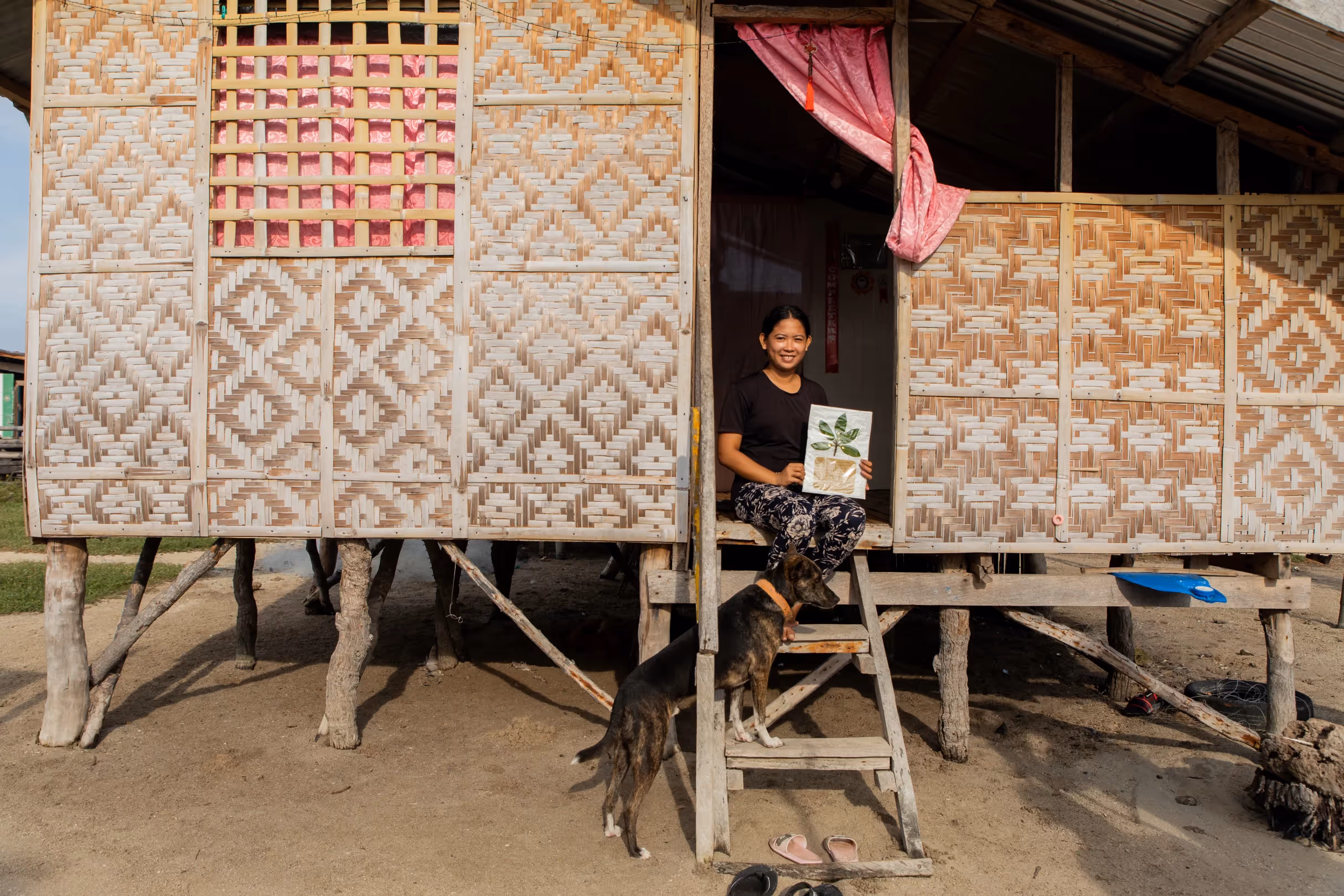 Hazel, a Filipino woman, poses for a portrait in her home in Inanuran Island in Tubigon, Bohol.