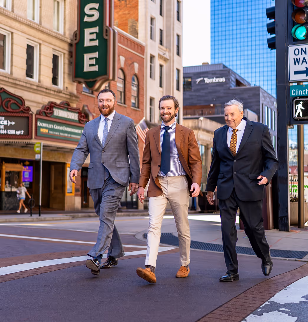 The Burks & Ogle legal team walking through downtown Knoxville.