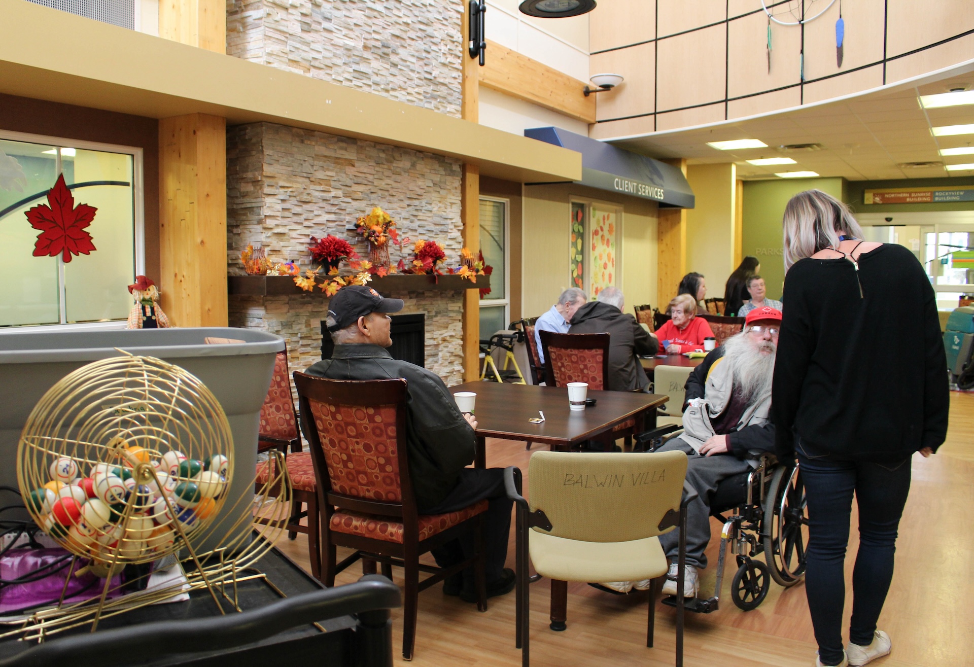 Balwin Villa lounge image with residents hanging around.
