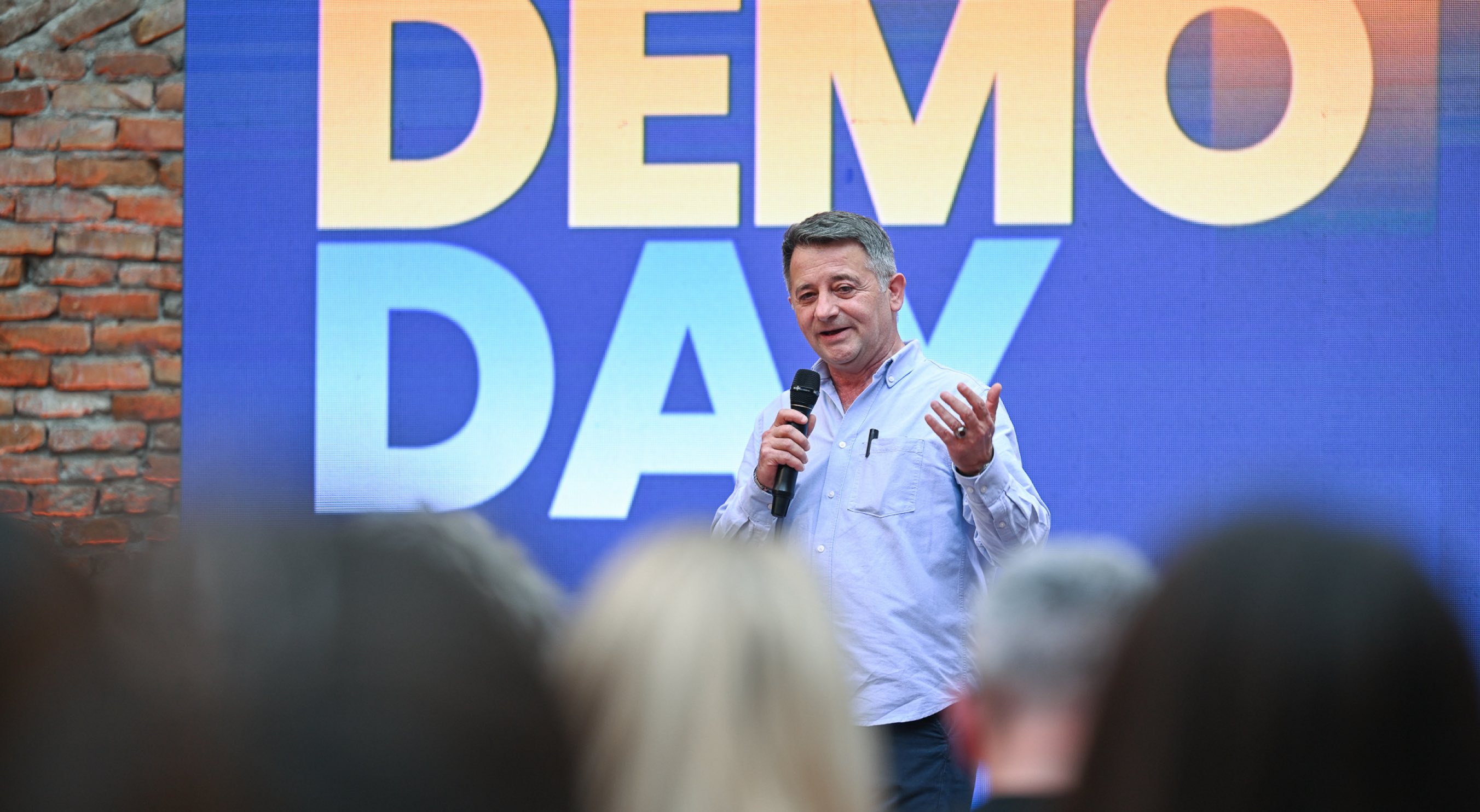 Growpreneur Demo Day 2026 — speaker addressing founders and investors at the Albanian startup accelerator event.