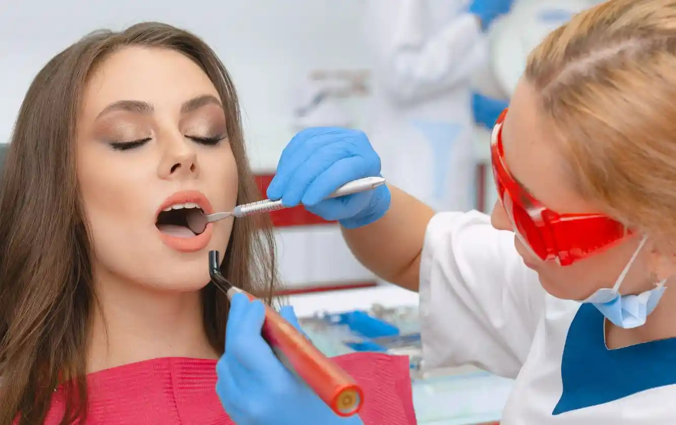 Cosmetic dental treatment using a curing light performed by a professional cosmetic dentist near me in Lathrup Village, MI
