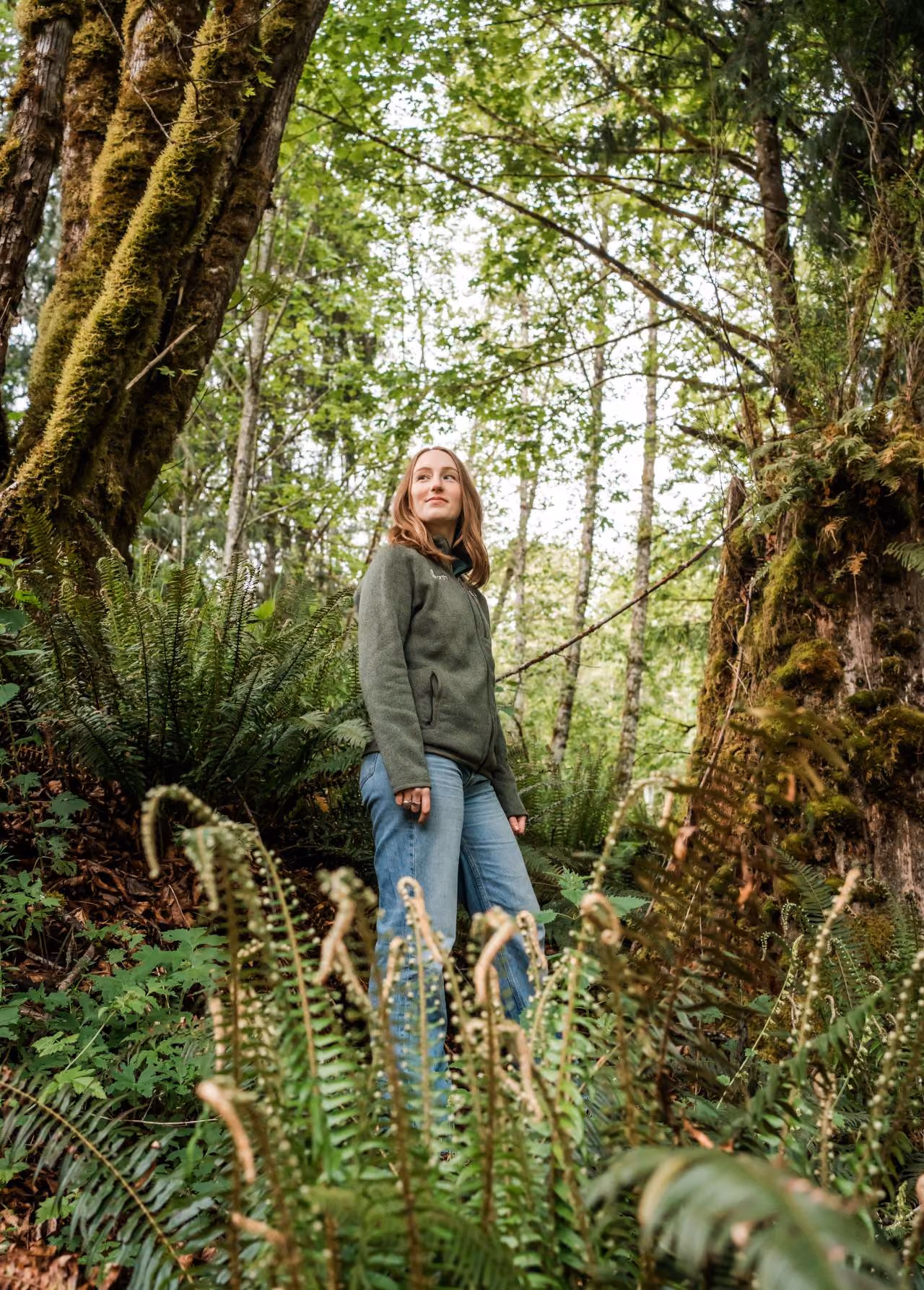 An Earth teammate standing in the woods at the Olympic Peninsula in Washington state