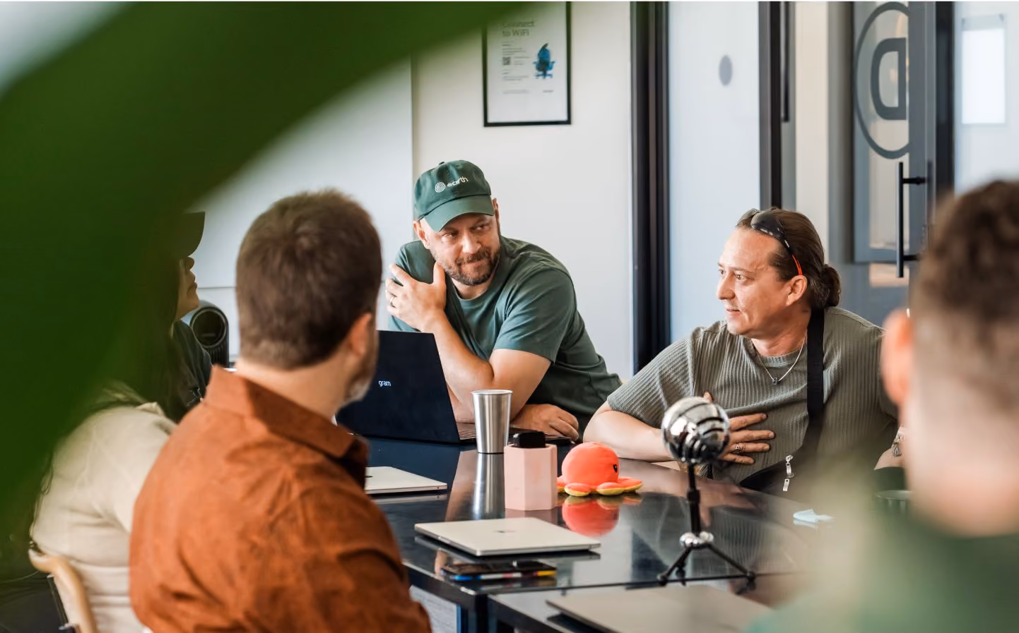 Earth employees in a meeting in a professional setting
