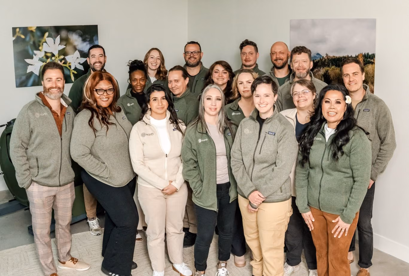 Around twenty Earth team members standing in the greeting room in Earth's Las Vegas facility.