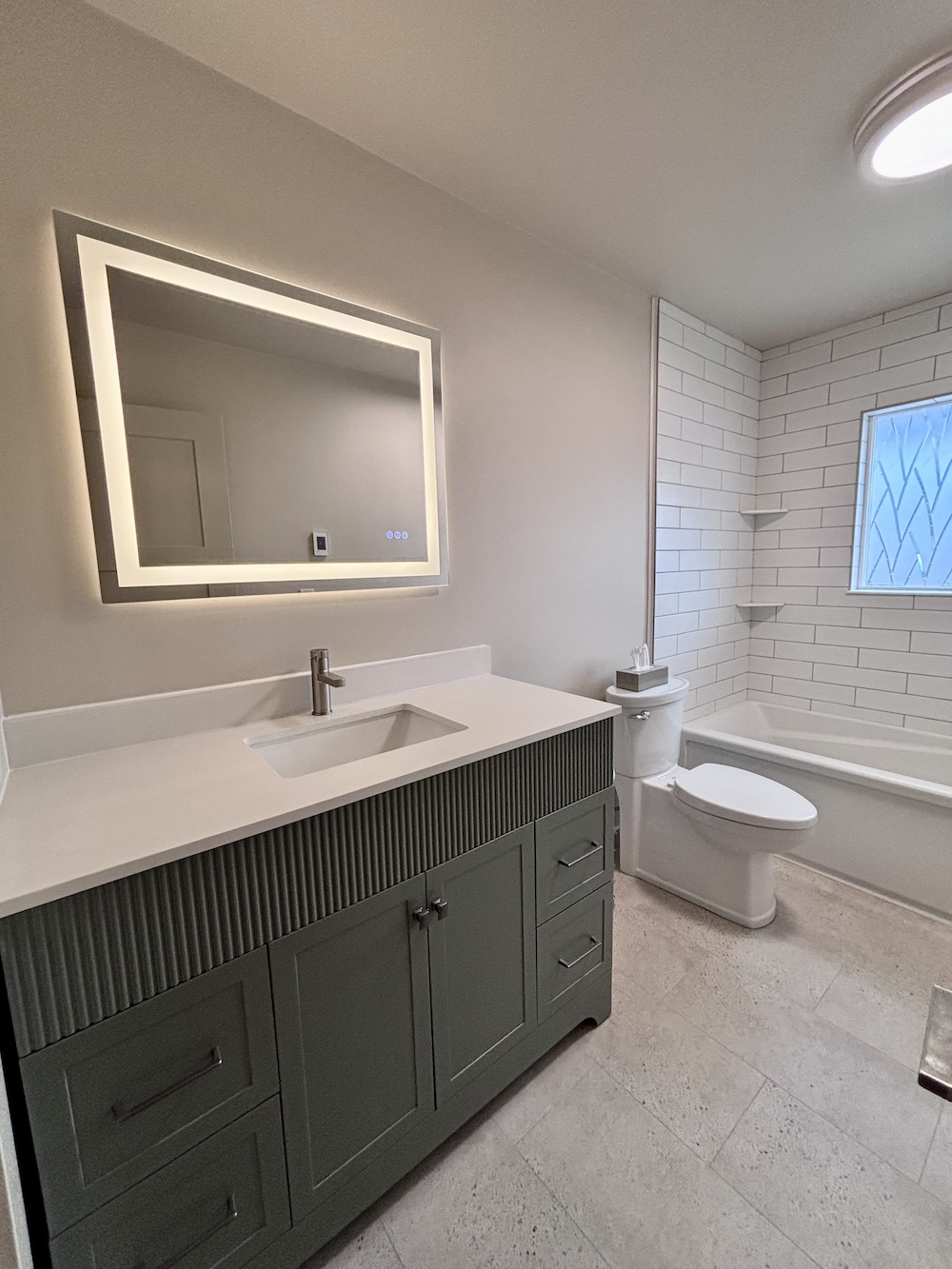 Bathroom renovation of a sink and toilet