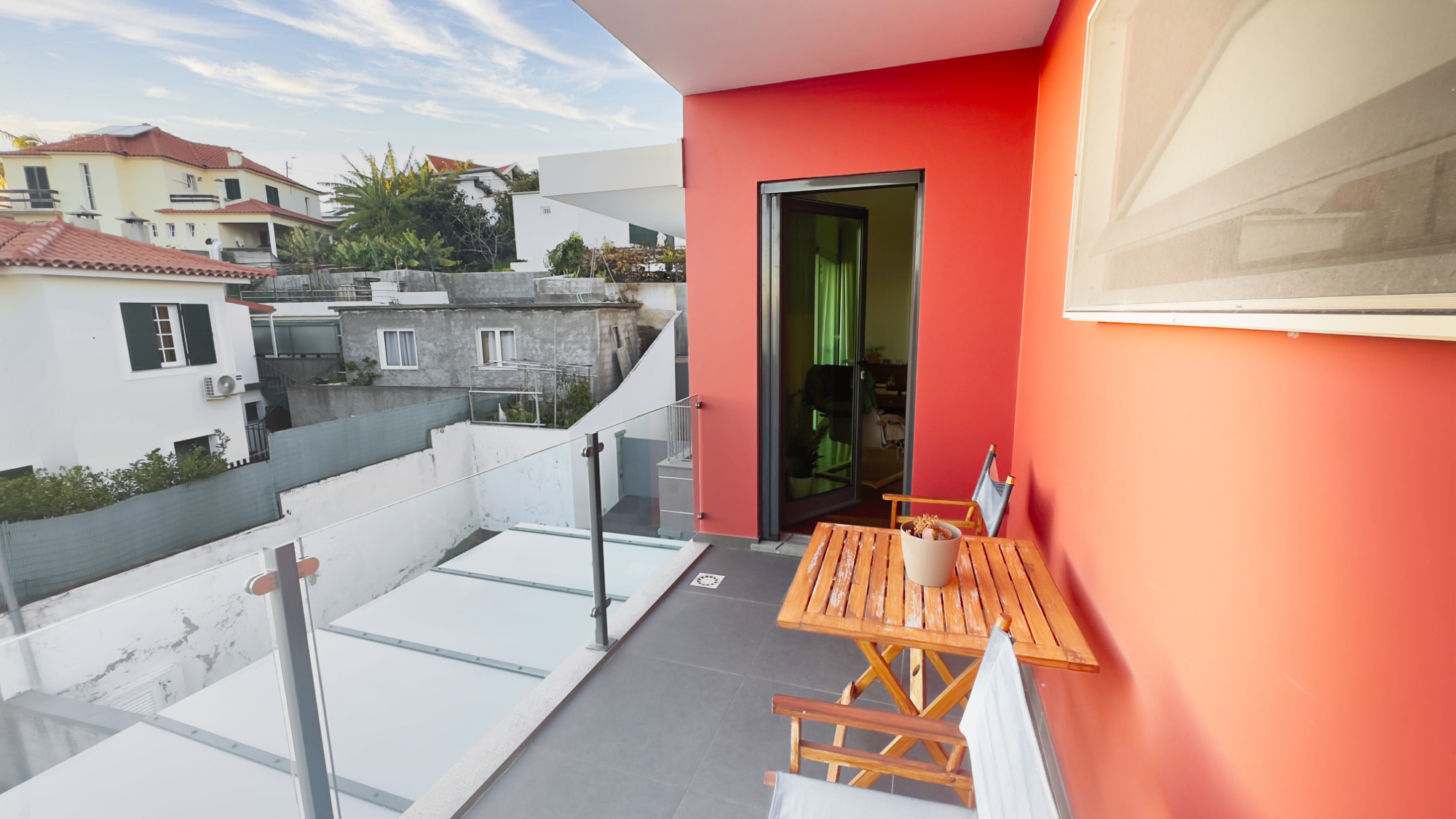 Lounge of the modern Funchal home with access to the balcony