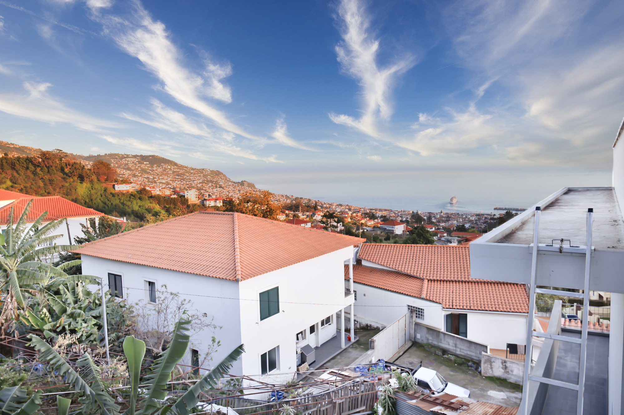 House exterior in a quiet Funchal neighbourhood with sea view over the bay