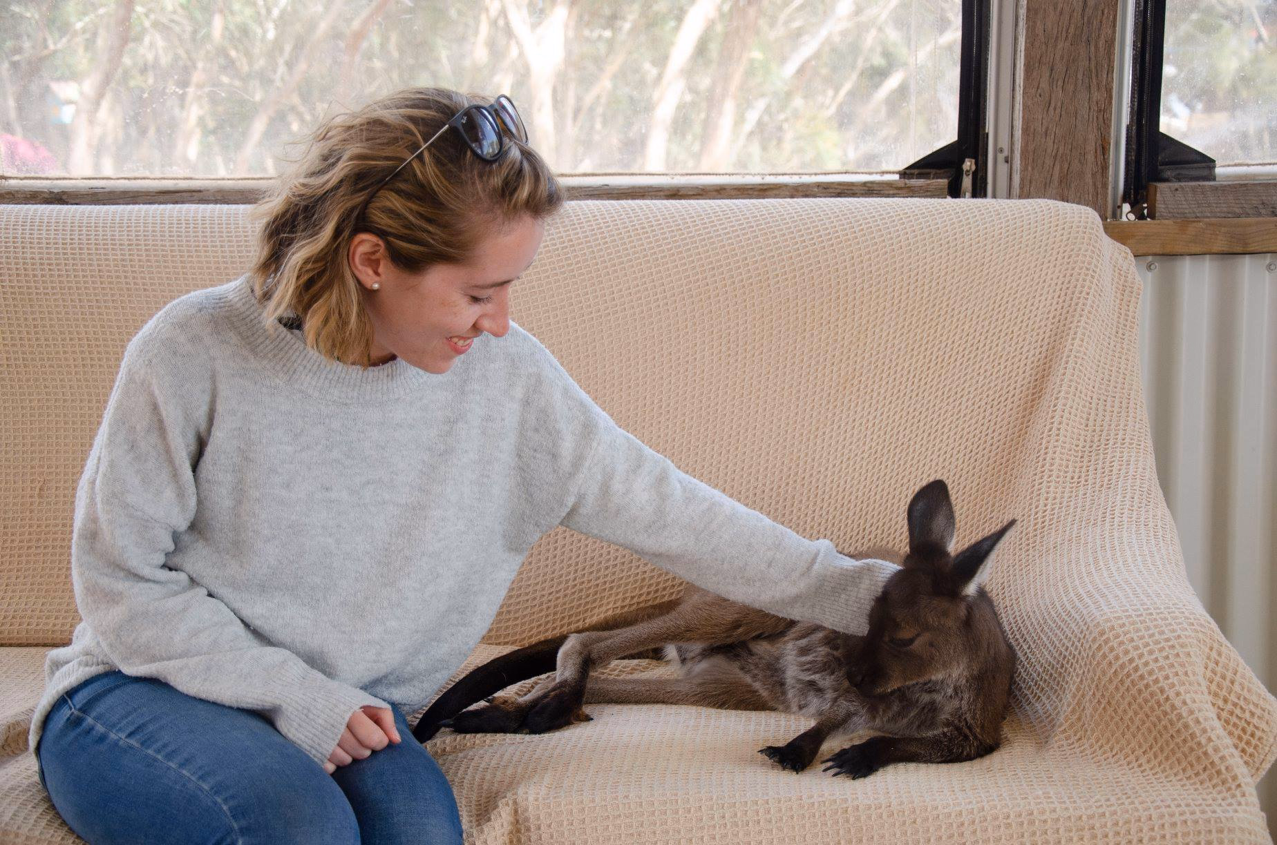 Rebecca Millar with a kangaroo in Adelaide, Australia before her move to Victoria, BC.