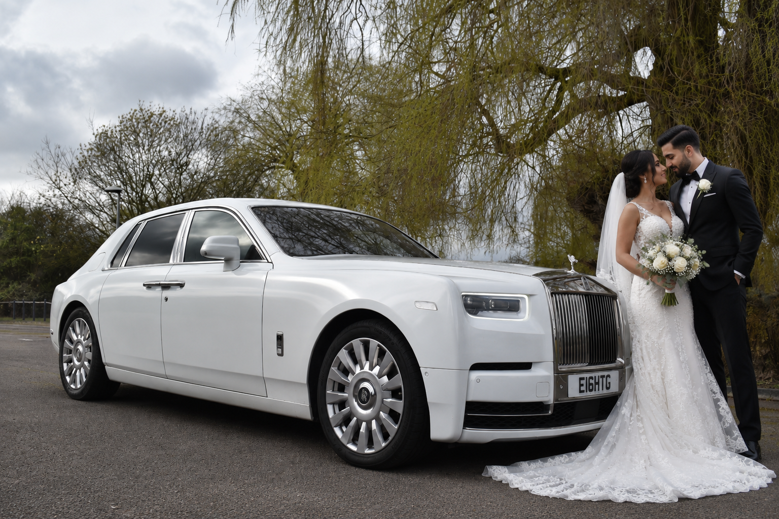 White Rolls Royce Phantom 8 wedding car with bride and groom for wedding car hire