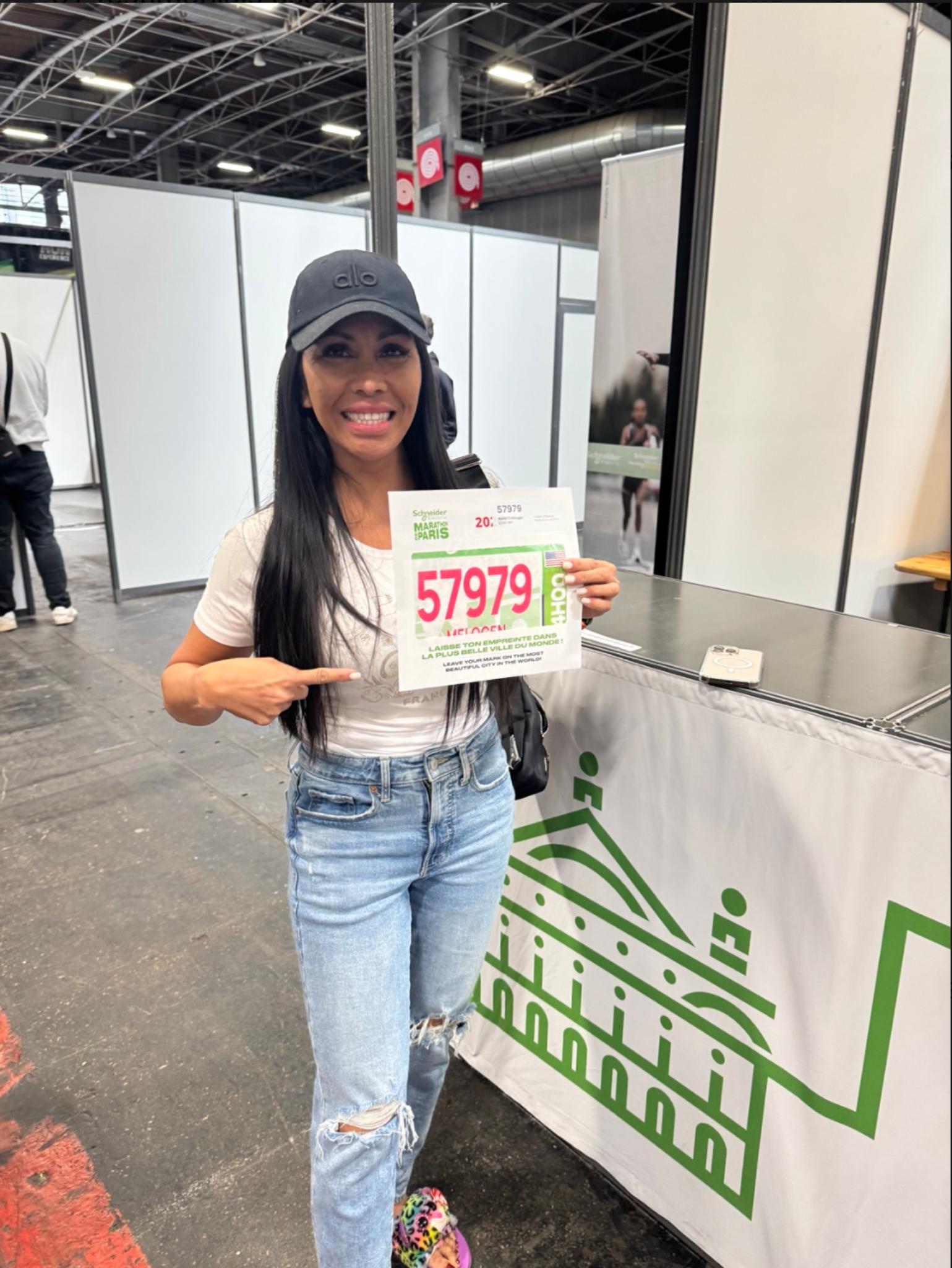 Runner collecting her race bib