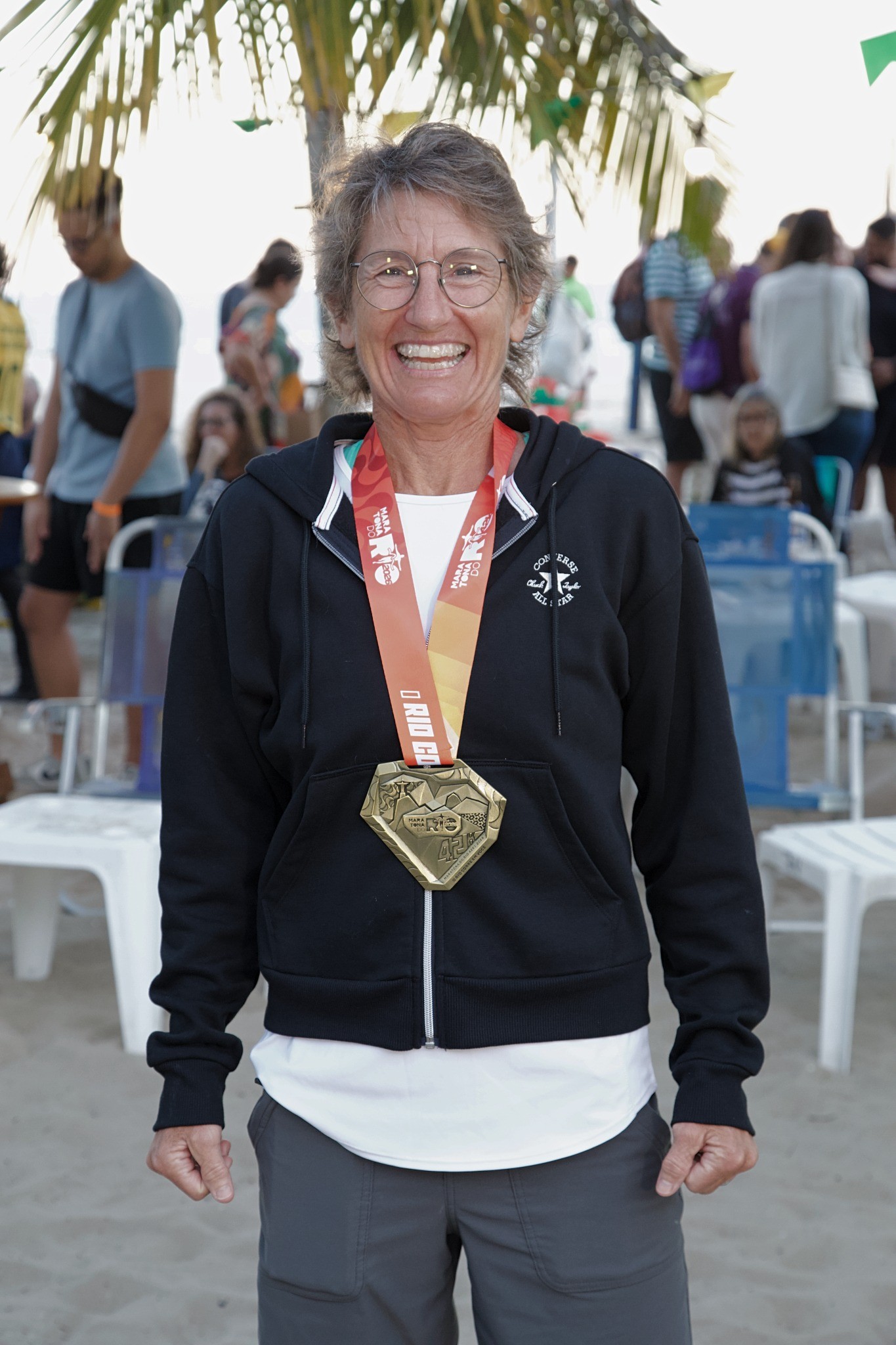 Runner wearing a finisher medal