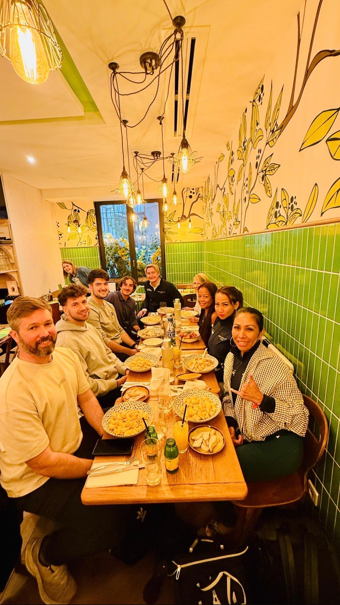 Race Beyond travellers enjoying a group dinner