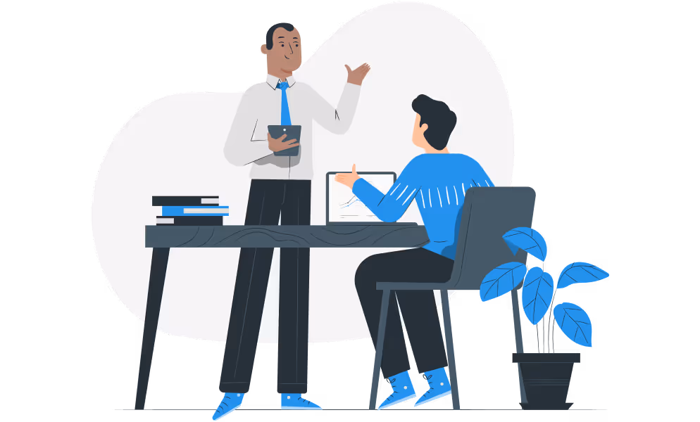 Illustration of two colleagues having a discussion at a desk with a laptop and books, representing consultation or planning.