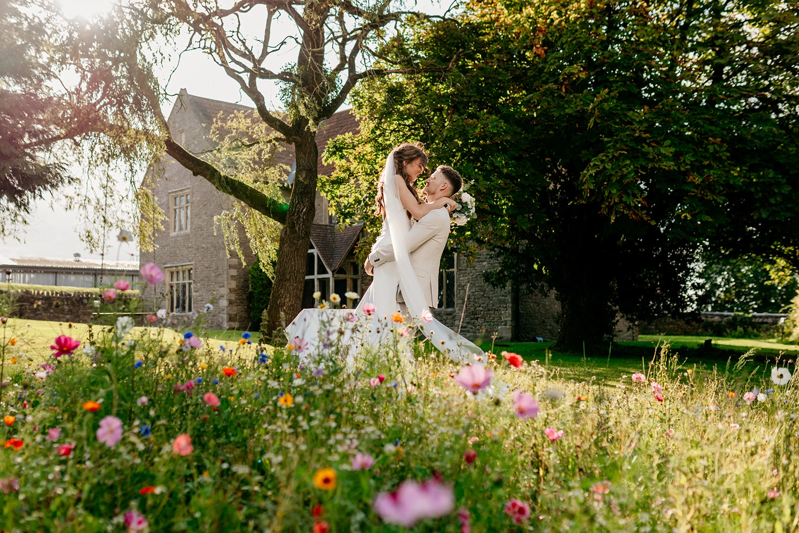 Groom lifting bride