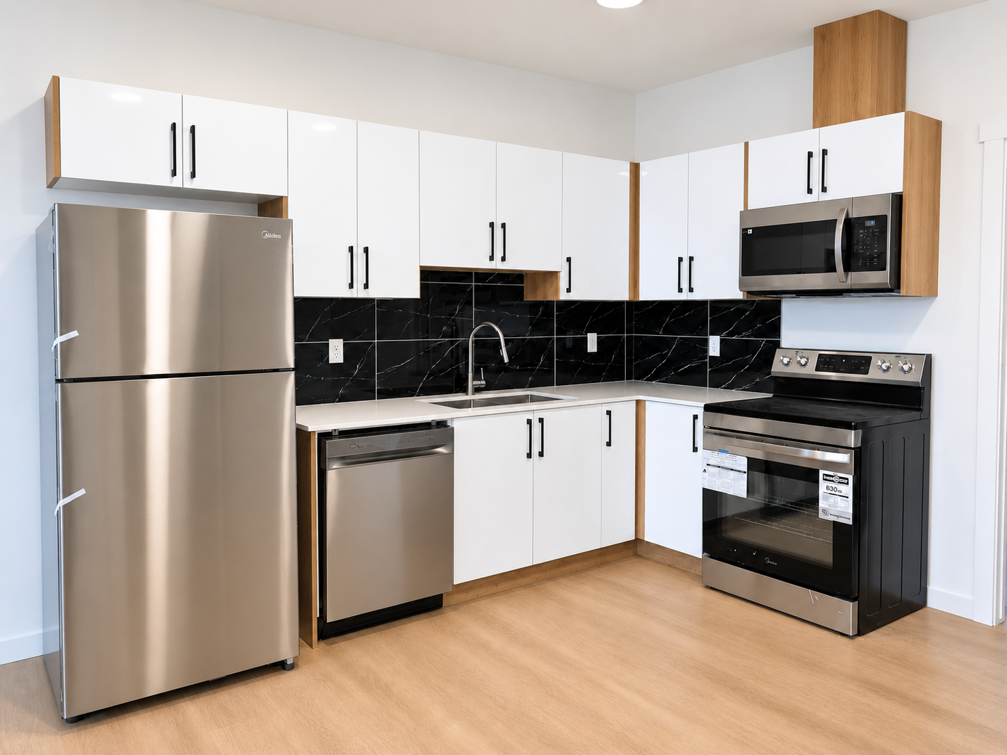 Basement-suite kitchen with stainless steel appliances at 8016–159 Street NW