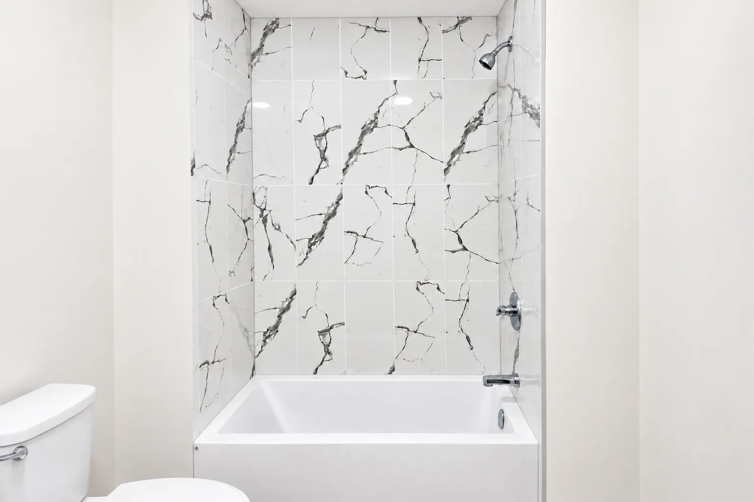 Basement-suite bathtub and shower surround at 8016–159 Street NW — Rendering: framing extended.