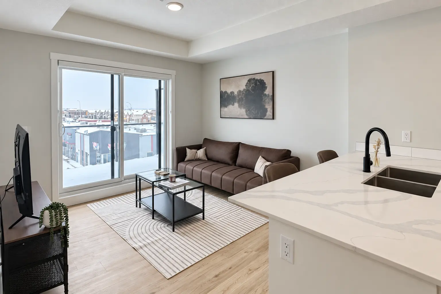 Living room and balcony door at Saddlepeace Village