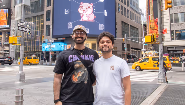 Shreyash Nigam in time's square in front of every.io co-sponsored billboard