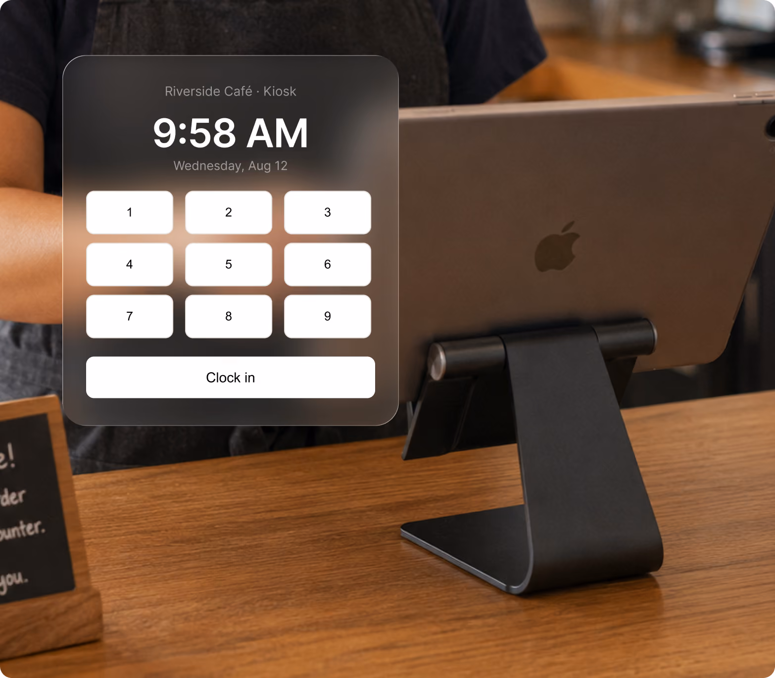 iPad kiosk at a cafe counter running the Every time clock with PIN pad clock-in