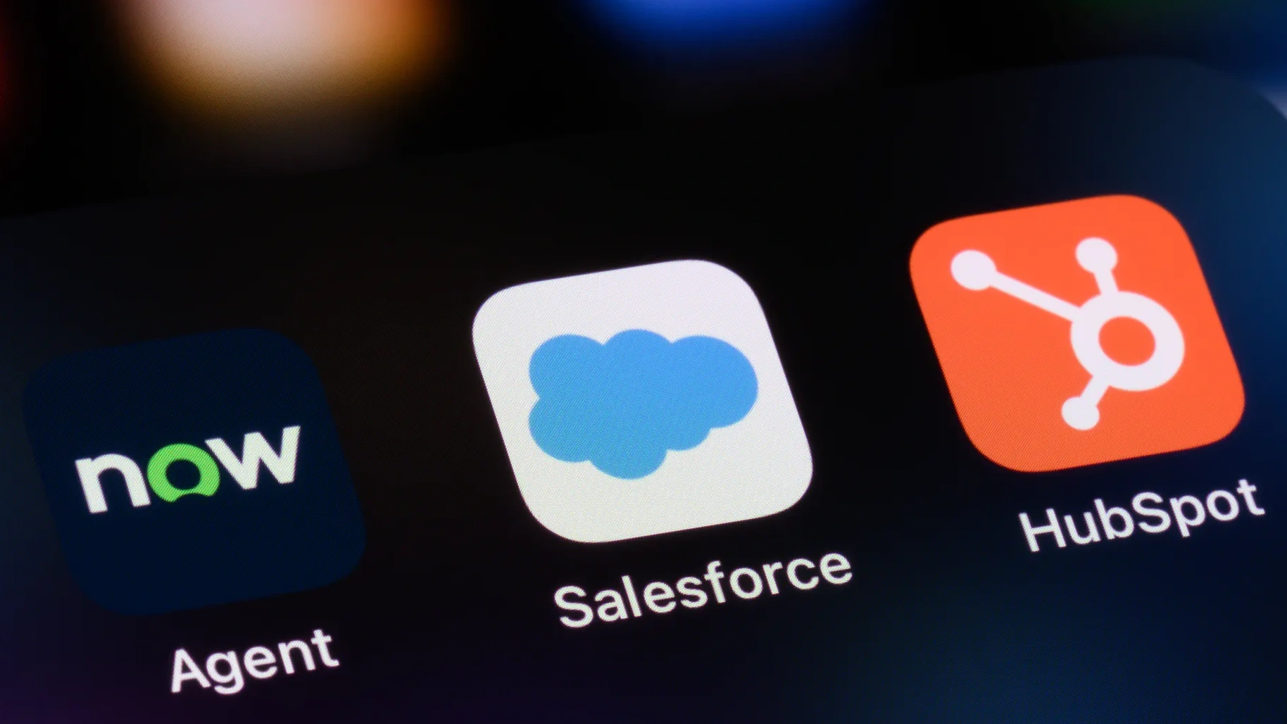 Close-up of mobile apps including Salesforce and HubSpot icons.