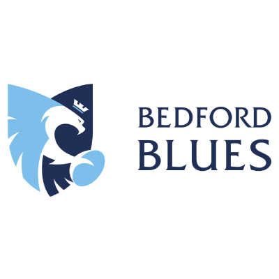 Bedford Blues rugby team logo featuring a stylized blue and white bird with a rugby ball.