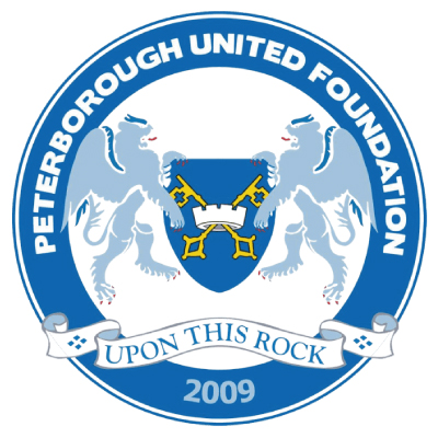 Peterborough United Foundation logo featuring two white lions holding a blue shield with crossed gold keys and a white banner with the motto 'Upon This Rock' and the year 2009.