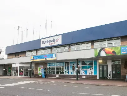 Humberside Airport terminal building with blue roof and signage