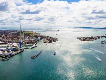 Aerial view of the Spinnaker Tower and the harbour entrance with boats on the water in Portsmouth
