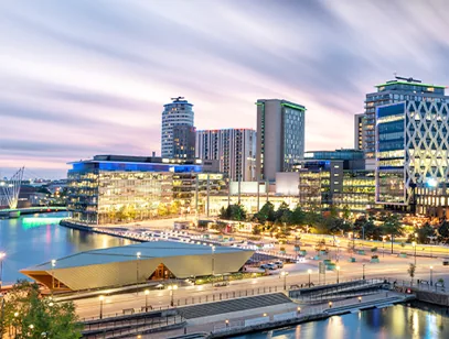 Waterside offices and apartment buildings at dusk at MediaCityUK in Salford