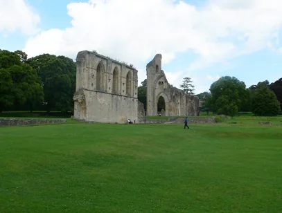 Ruined stone abbey walls on a wide green lawn in Somerset near Yeovil