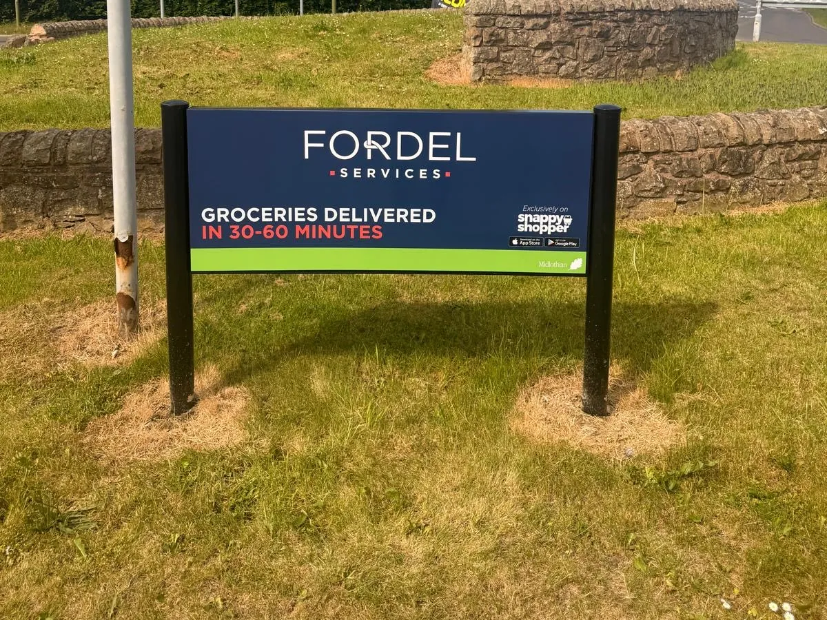 Fordel roundabout sponsorship sign in Midlothian
