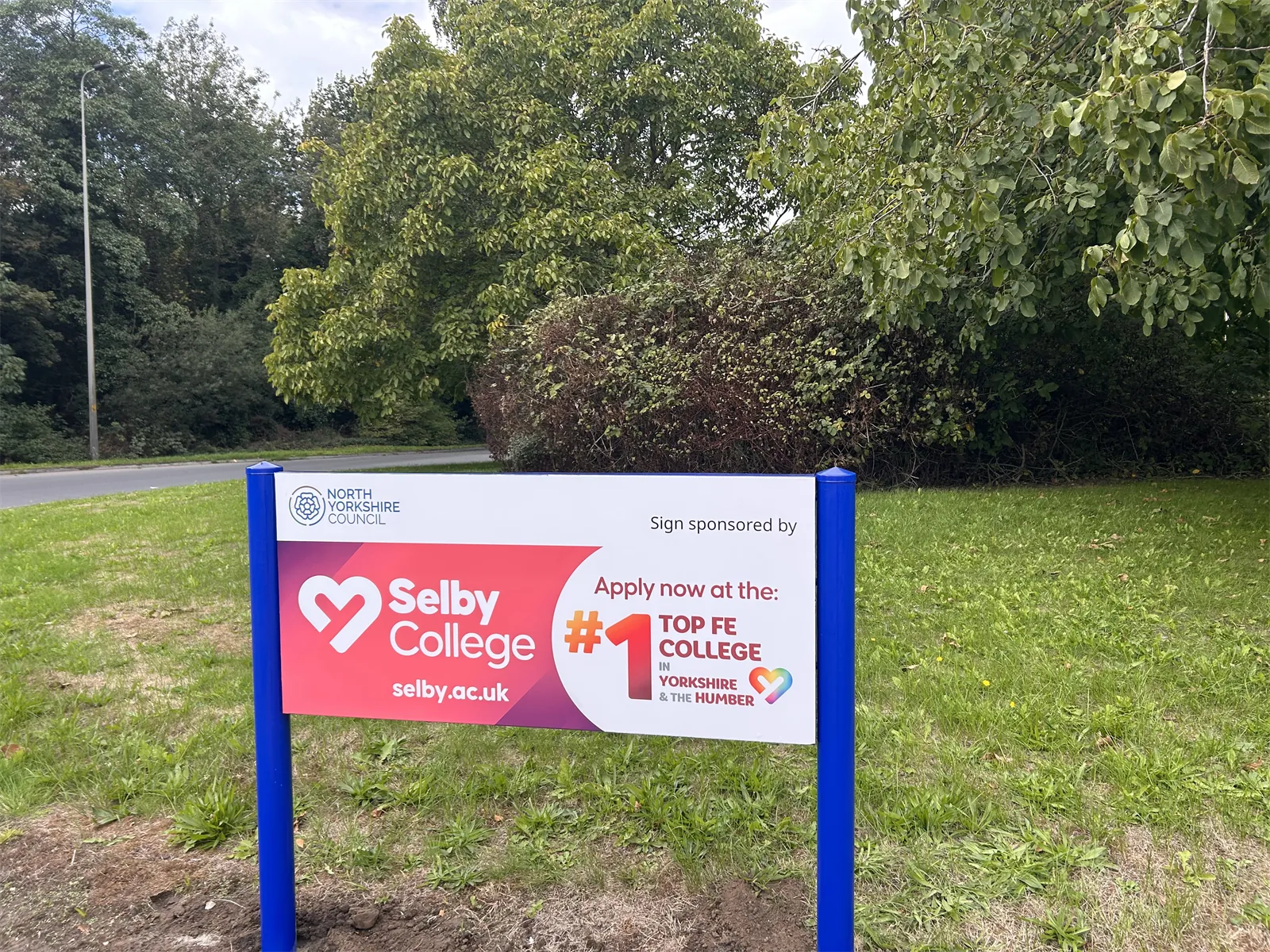 Selby College roundabout sponsorship sign in Selby
