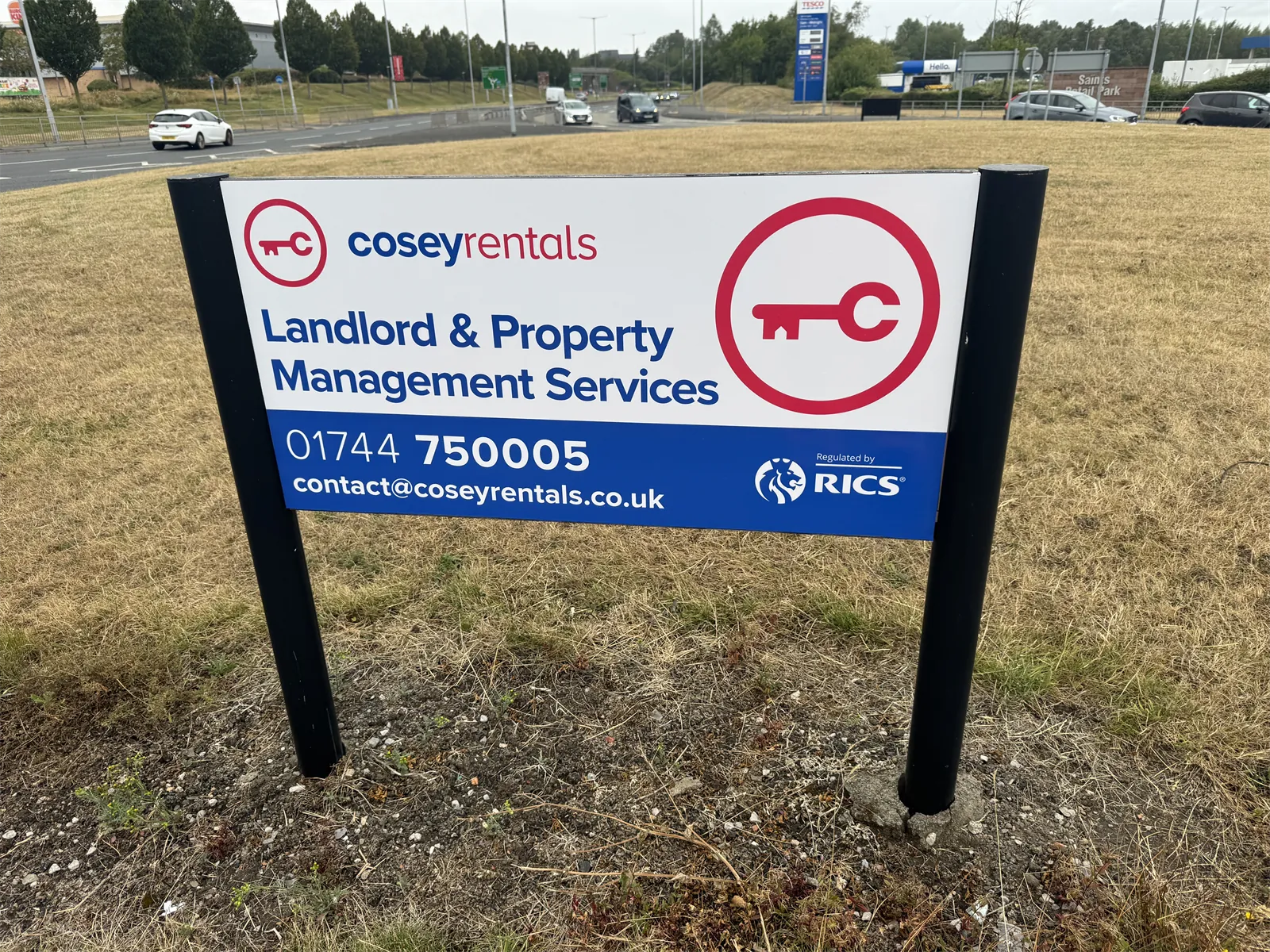 Cosey Rentals roundabout sponsorship sign in St Helens