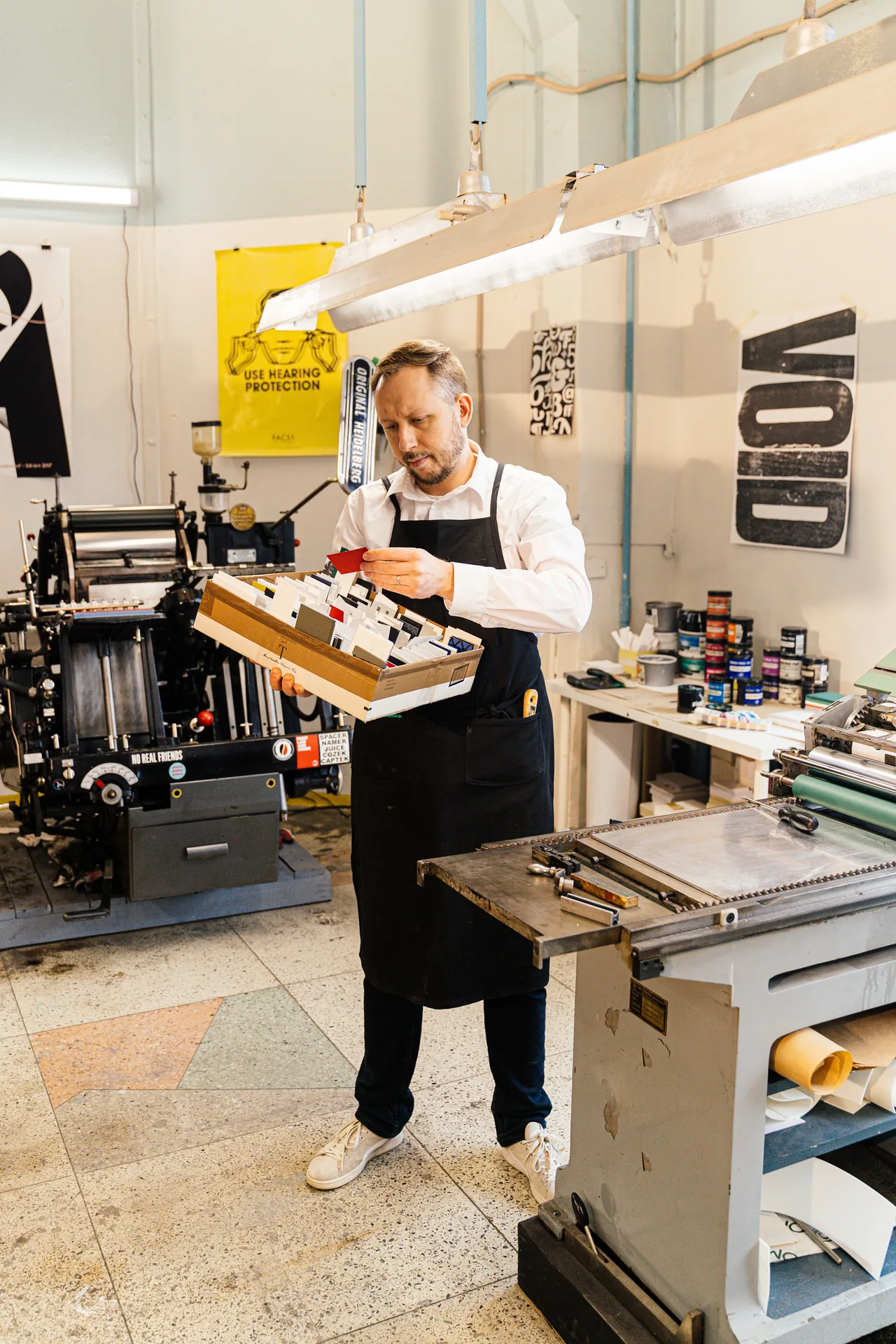 Print operator running a press during a production shift