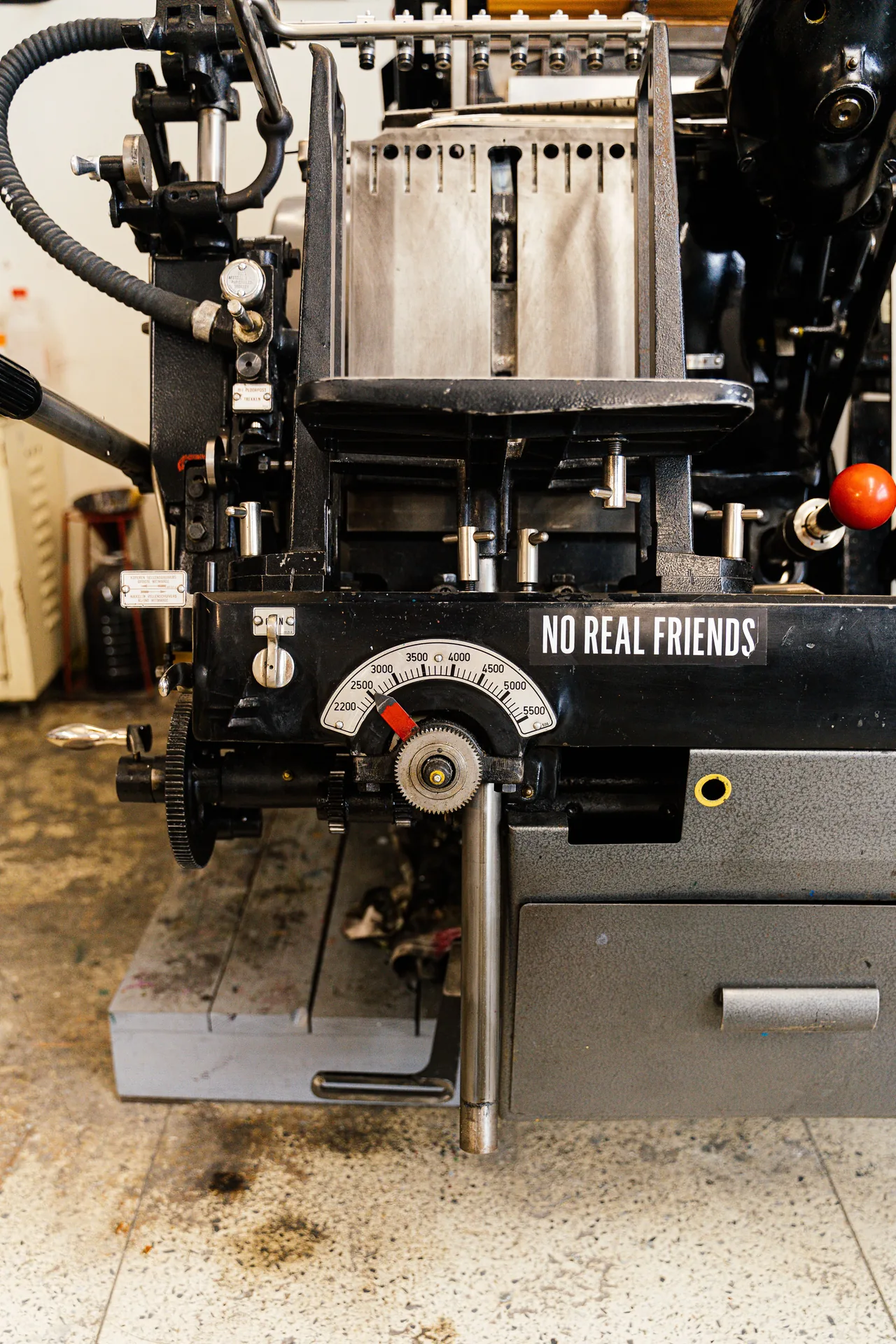 Close-up of a printing press cylinder and inked plate