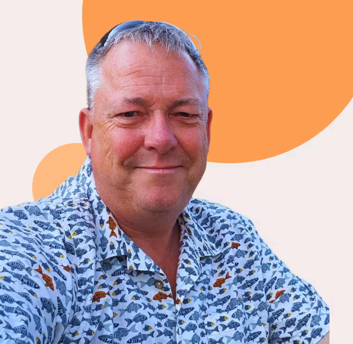 Andrew, Event Consultant at My Freelance Admin, smiling against an orange and cream background.