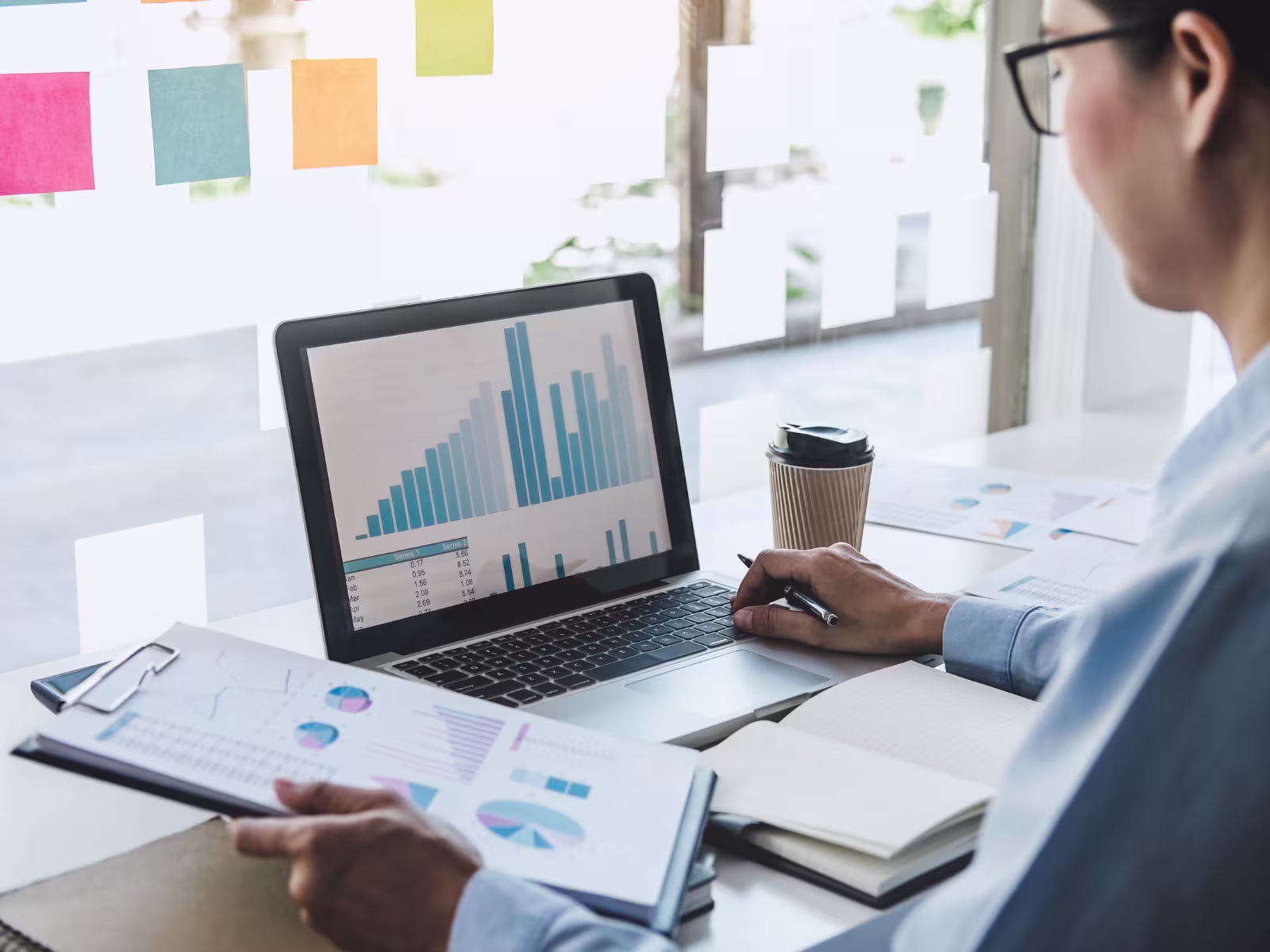 Business professional reviewing marketing performance data and planning activity